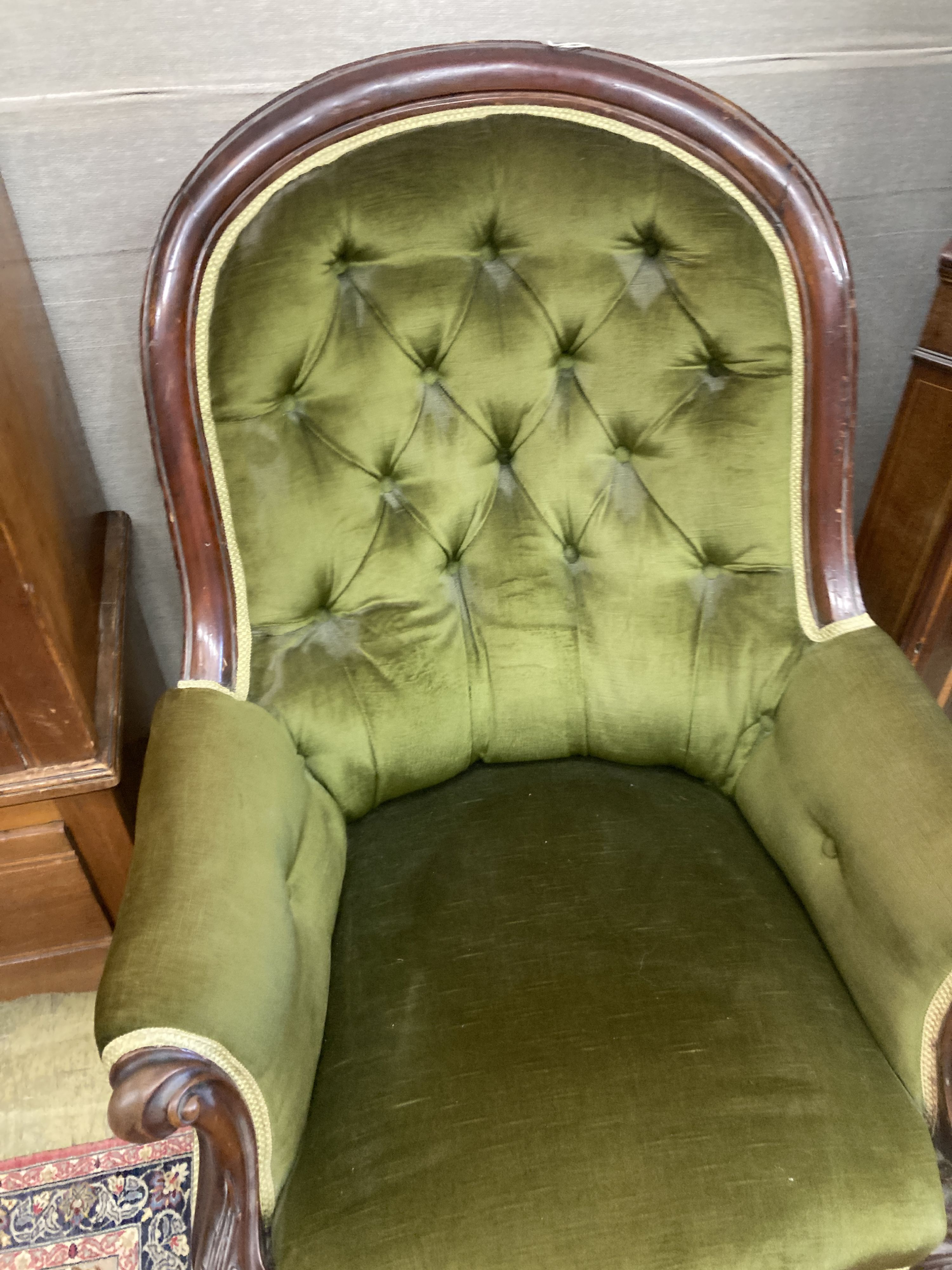 A Victorian mahogany spoonback armchair, width 88cm, depth 80cm, height 94cm